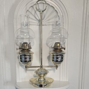 This is a vintage brass double oil lamp